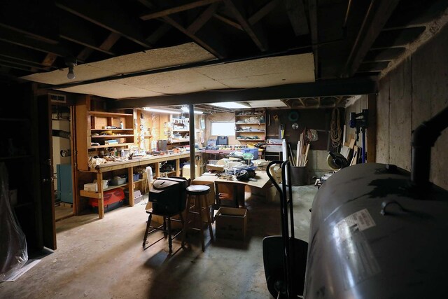 unfinished below grade area with a workshop area