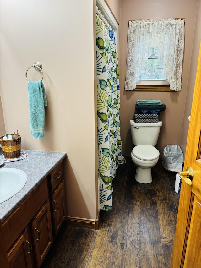 71 Reynolds Rd, Brooks, ME 04921 - full bath with toilet, wood finished floors, baseboards, vanity, and a shower with shower curtain