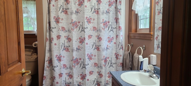 71 Reynolds Rd, Brooks, ME 04921 - full bathroom featuring vanity, toilet, and a shower with shower curtain