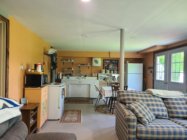 71 Reynolds Rd, Brooks, ME 04921 - living room featuring finished concrete floors