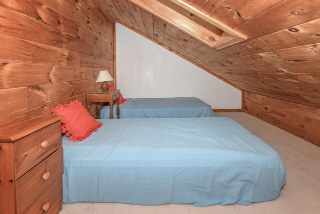 676 S High St, Bridgton, ME 04009 - bedroom with vaulted ceiling, wooden walls, and wood ceiling