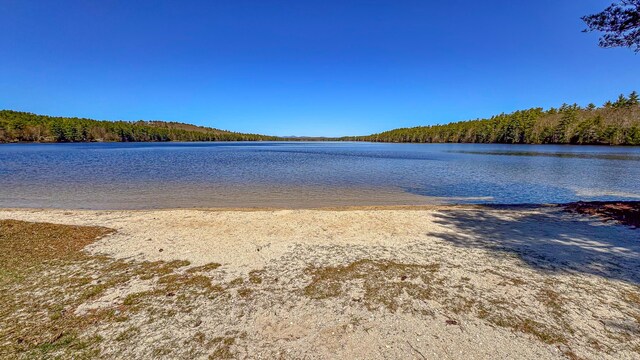 676 S High St, Bridgton, ME 04009 - property view of water with a wooded view