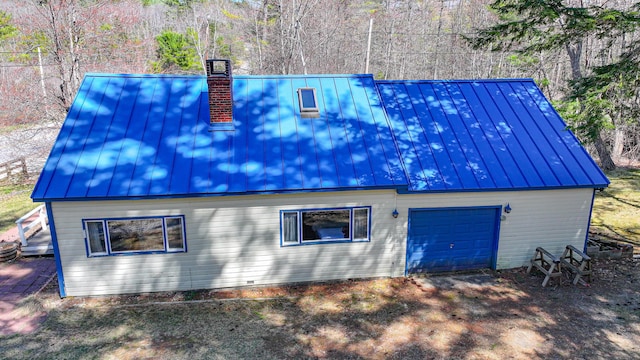 676 S High St, Bridgton, ME 04009 - exterior space with metal roof, a standing seam roof, and a chimney