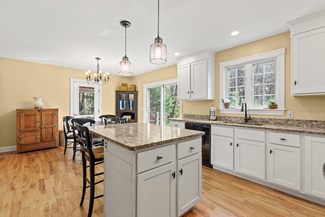 4 Geary Way, Falmouth, ME 04105 - kitchen with black dishwasher, a sink, light wood-type flooring, a kitchen island, and recessed lighting