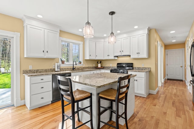 4 Geary Way, Falmouth, ME 04105 - kitchen with dishwashing machine, black gas stove, a breakfast bar, white cabinets, and recessed lighting