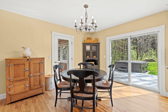 4 Geary Way, Falmouth, ME 04105 - dining space featuring a chandelier, light wood-style floors, and baseboards