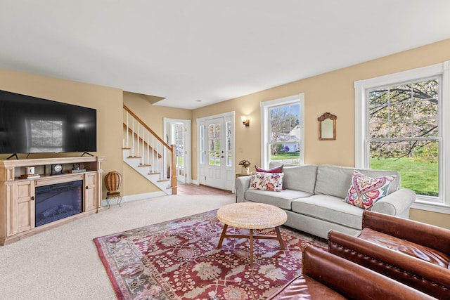 4 Geary Way, Falmouth, ME 04105 - living area featuring stairway, plenty of natural light, carpet floors, and baseboards