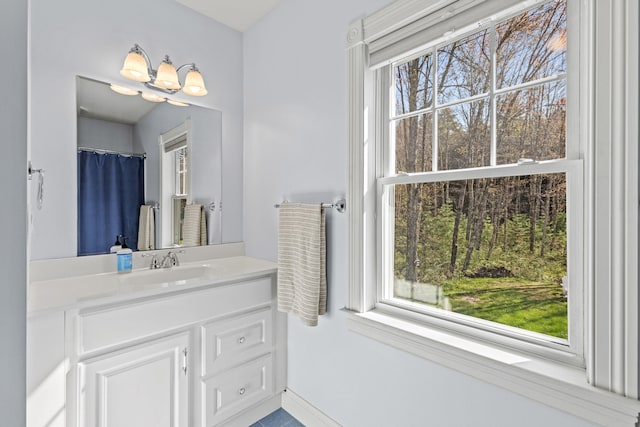 4 Geary Way, Falmouth, ME 04105 - bathroom featuring vanity, baseboards, and a chandelier