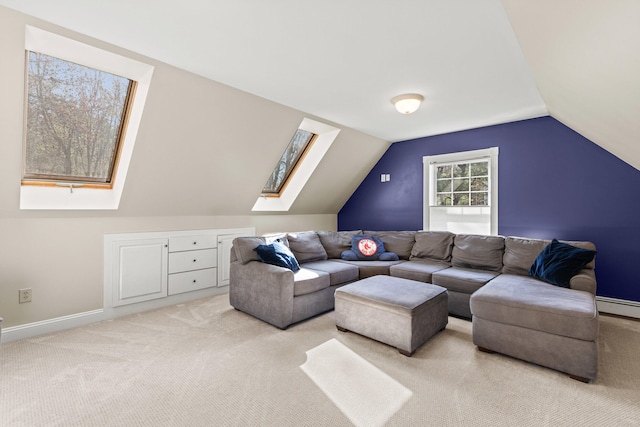4 Geary Way, Falmouth, ME 04105 - living room with a skylight, light colored carpet, a baseboard radiator, vaulted ceiling, and baseboards