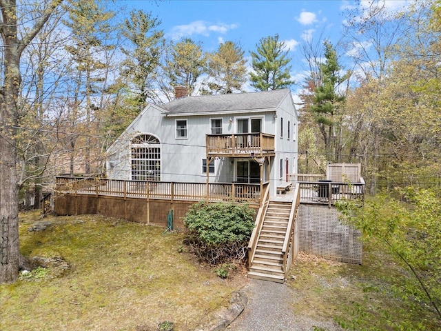 25 Sawmill Ln, Ogunquit, ME 03907 - rear view of property with a wooden deck, stairway, a chimney, and a shingled roof
