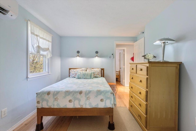 25 Sawmill Ln, Ogunquit, ME 03907 - bedroom with light wood finished floors and a wall unit AC