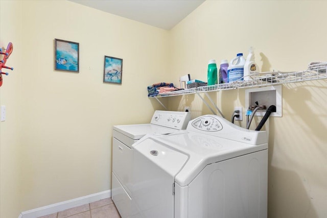 25 Sawmill Ln, Ogunquit, ME 03907 - laundry area with washing machine and dryer and light tile patterned floors