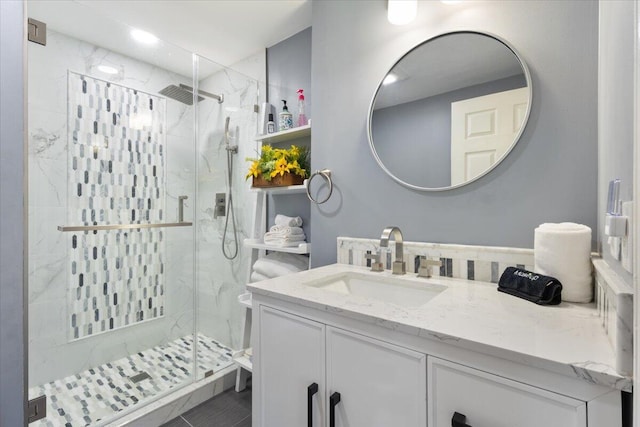 25 Sawmill Ln, Ogunquit, ME 03907 - bathroom featuring vanity, a marble finish shower, and recessed lighting