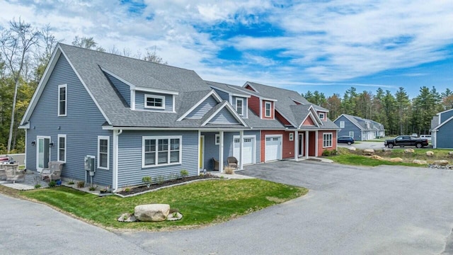 10 Haleys Ct Unit 22, Wells, ME 04090 - view of front of home featuring driveway, a front yard, and a shingled roof