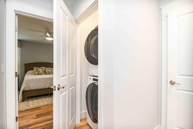 10 Haleys Ct Unit 22, Wells, ME 04090 - laundry area featuring stacked washer and clothes dryer, a ceiling fan, and light wood-style flooring