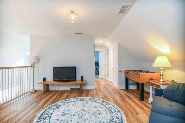 10 Haleys Ct Unit 22, Wells, ME 04090 - living area featuring vaulted ceiling, wood finished floors, and baseboards