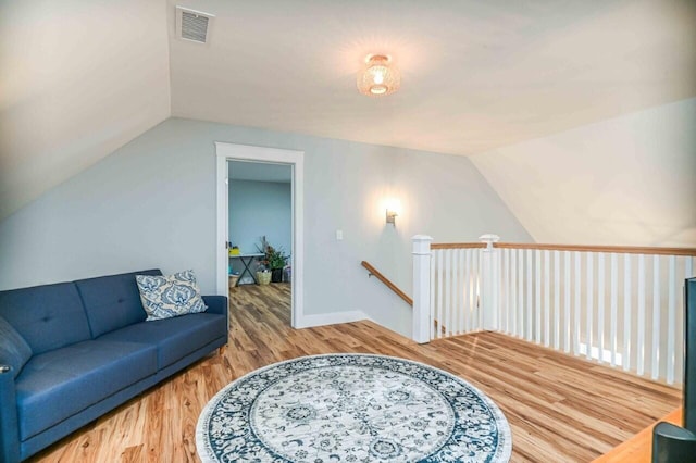 10 Haleys Ct Unit 22, Wells, ME 04090 - living area featuring lofted ceiling and wood finished floors