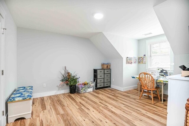 10 Haleys Ct Unit 22, Wells, ME 04090 - office featuring wood finished floors, baseboards, and lofted ceiling