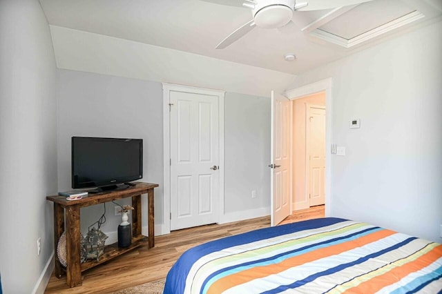 10 Haleys Ct Unit 22, Wells, ME 04090 - bedroom featuring wood finished floors, vaulted ceiling, baseboards, and a ceiling fan