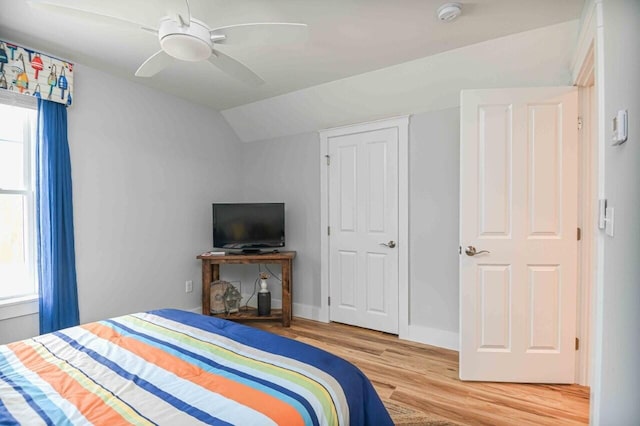10 Haleys Ct Unit 22, Wells, ME 04090 - bedroom with wood finished floors, lofted ceiling, multiple windows, ceiling fan, and baseboards