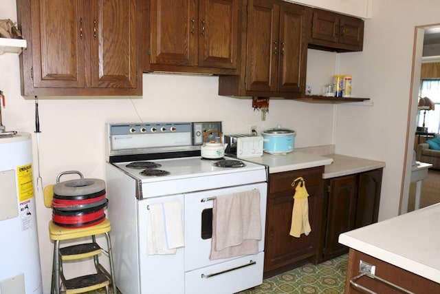 68 Salmon Rd, Madison, ME 04950 - kitchen featuring white electric range oven, water heater, and light countertops