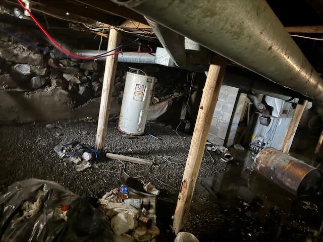 utilities featuring crawl space and water heater