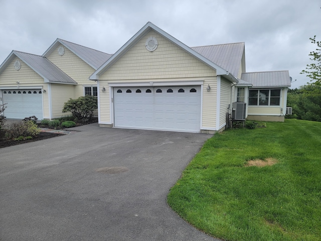 239 Pierce Rd Unit 2B, Brewer, ME 04412 - single story home featuring central AC, asphalt driveway, metal roof, a front yard, and an attached garage