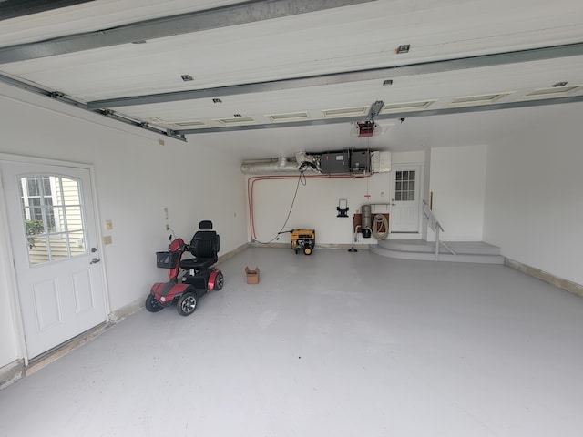 239 Pierce Rd Unit 2B, Brewer, ME 04412 - garage with baseboards and a garage door opener