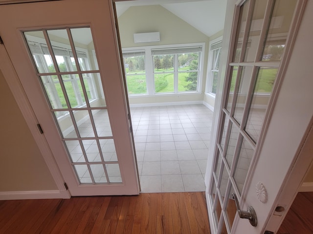 239 Pierce Rd Unit 2B, Brewer, ME 04412 - doorway to outside with lofted ceiling, baseboards, healthy amount of natural light, and light tile patterned floors