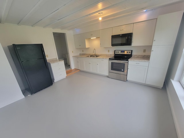239 Pierce Rd Unit 2B, Brewer, ME 04412 - kitchen featuring black appliances, a sink, white cabinetry, concrete floors, and light stone countertops