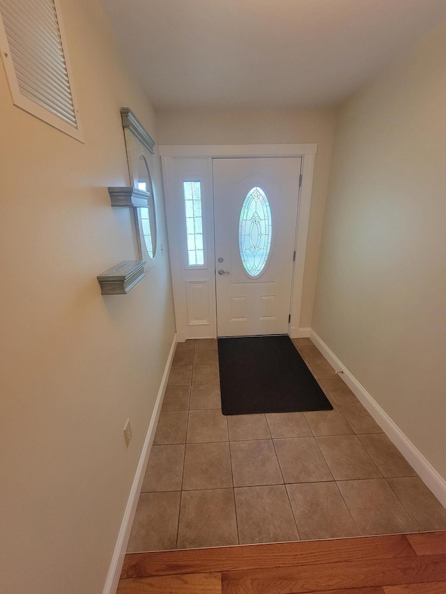 239 Pierce Rd Unit 2B, Brewer, ME 04412 - foyer entrance featuring light tile patterned floors and baseboards
