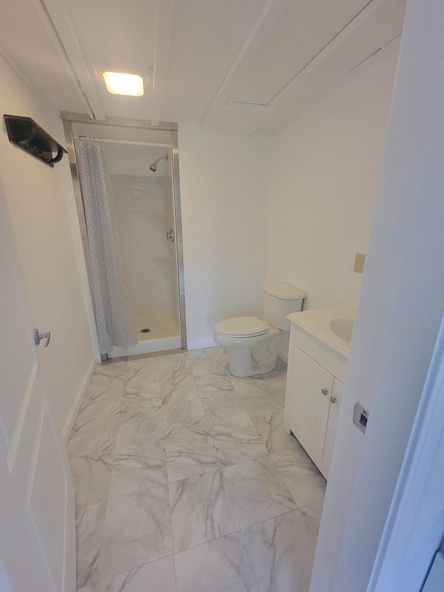 239 Pierce Rd Unit 2B, Brewer, ME 04412 - bathroom with a shower stall, toilet, vanity, marble finish flooring, and baseboards