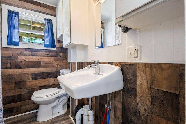 2 Airport Rd, Turner, ME 04282 - half bath featuring toilet, wood walls, and wood finished floors