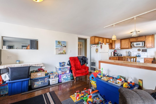 2 Airport Rd, Turner, ME 04282 - recreation room with rail lighting and dark wood-type flooring