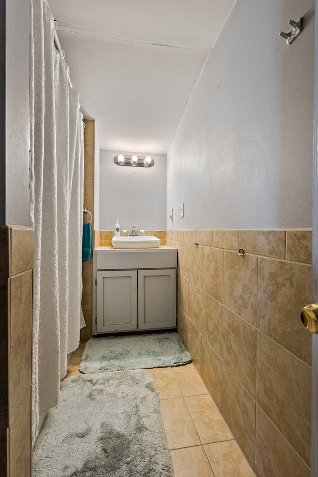 2 Airport Rd, Turner, ME 04282 - full bathroom featuring tile walls, vanity, tile patterned floors, wainscoting, and a shower with curtain