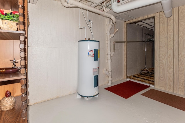 unfinished basement with water heater and a sink