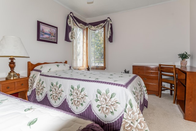 carpeted bedroom with crown molding and ceiling fan