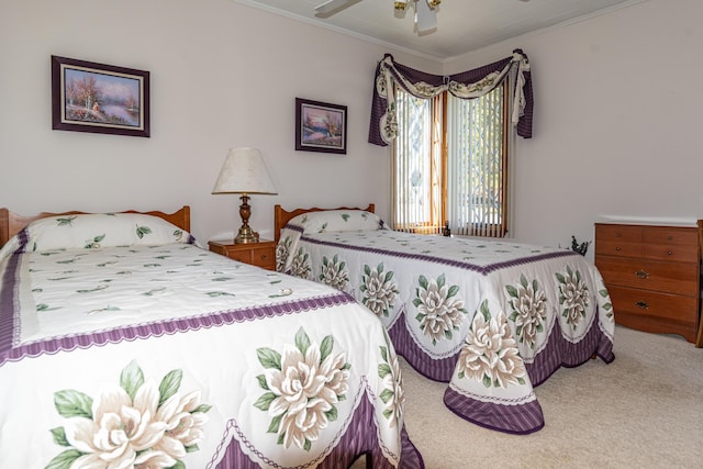 bedroom with carpet flooring, crown molding, and ceiling fan
