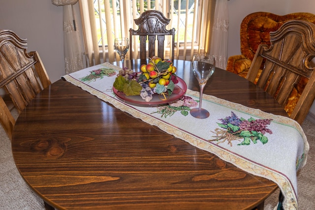 dining area featuring plenty of natural light and carpet flooring