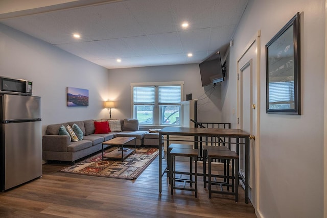 living room featuring recessed lighting and wood finished floors