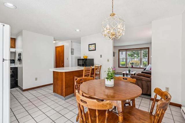 55 Lambert St Unit 4, Portland, ME 04103 - dining space featuring light tile patterned floors, a chandelier, recessed lighting, a baseboard heating unit, and baseboards
