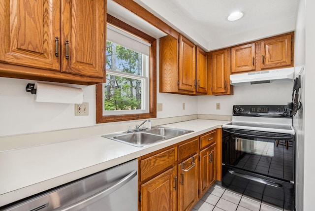 55 Lambert St Unit 4, Portland, ME 04103 - kitchen with under cabinet range hood, dishwasher, range with electric stovetop, brown cabinetry, and light tile patterned floors