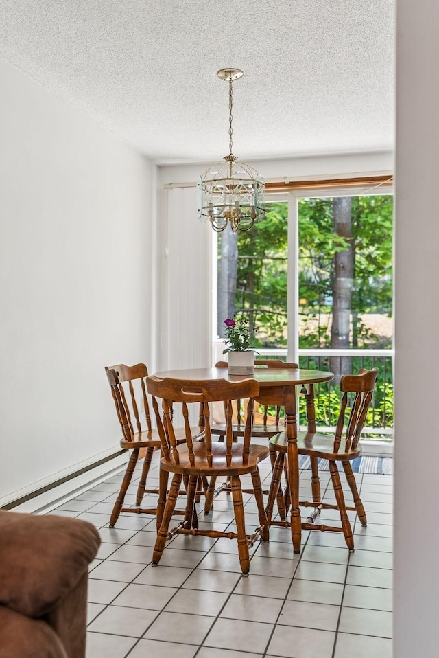 55 Lambert St Unit 4, Portland, ME 04103 - dining area with a chandelier, a textured ceiling, and a baseboard heating unit
