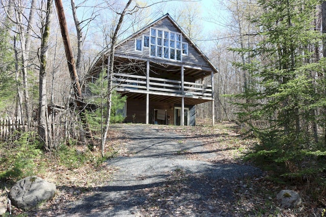50 Widgeon Rd, Madison, ME 04950 - exterior space with a wooden deck, driveway, and a view of trees