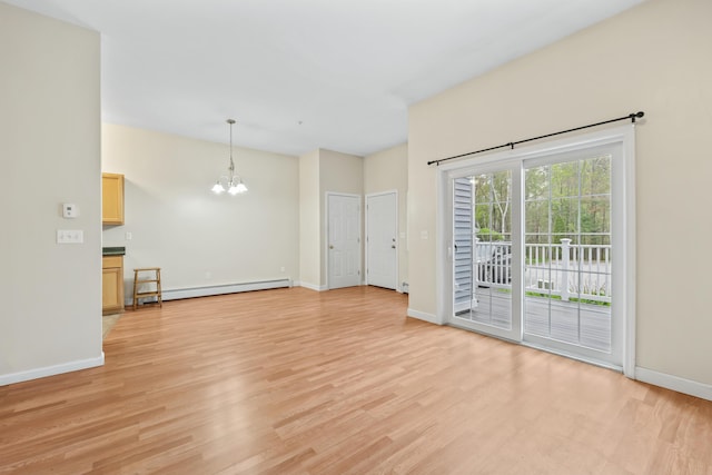 unfurnished living room featuring a baseboard radiator, a chandelier, light wood-style flooring, and baseboards
