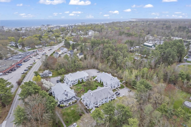 aerial view of property and surrounding area with a large body of water