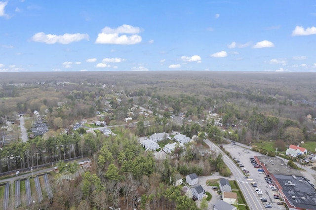 aerial overview of property's location featuring a heavily wooded area