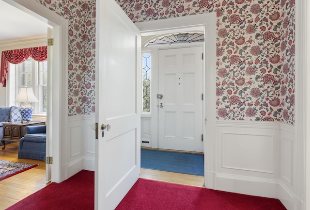 14 Highland St, Portland, ME 04103 - foyer with wallpapered walls, wainscoting, and wood-type flooring