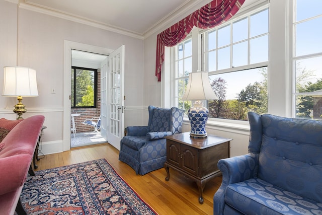 14 Highland St, Portland, ME 04103 - living area featuring hardwood / wood-style floors, ornamental molding, and baseboards