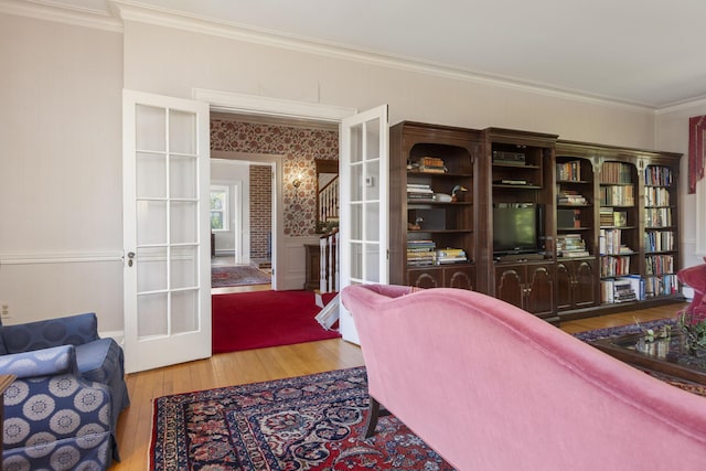 14 Highland St, Portland, ME 04103 - living area with wood finished floors, french doors, and ornamental molding